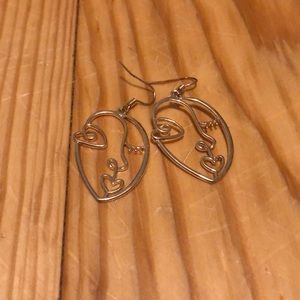 Face dangle earrings